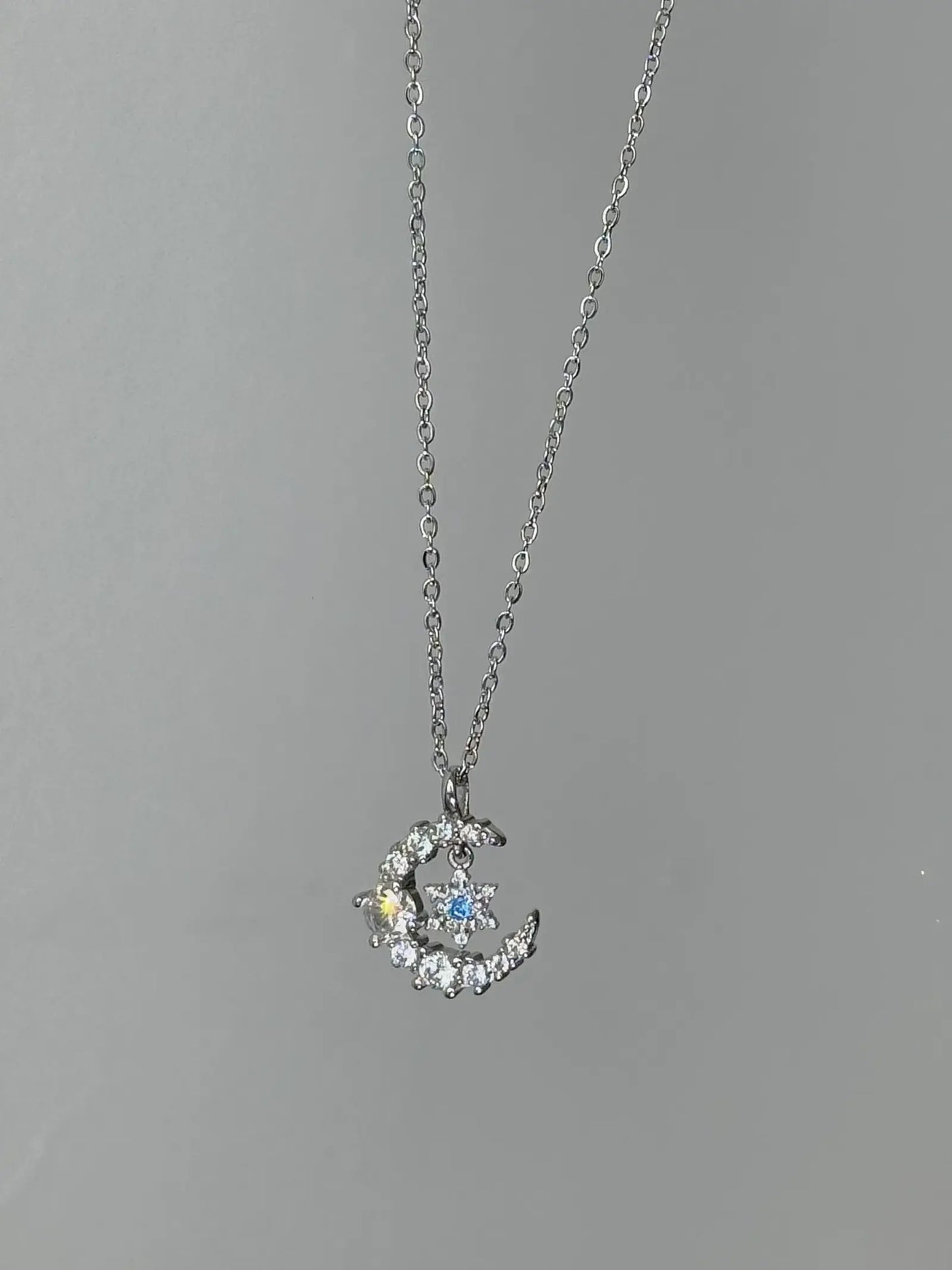 "Snow Dance Moonlight" 925 Sterling Silver Blue Diamond Snowflake Necklace - Cool Elegance and Gentle Charm.