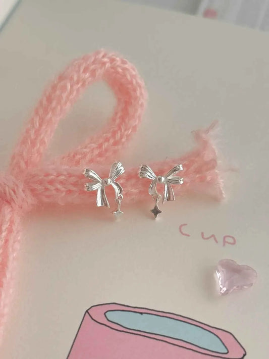 "Ballet Skirt" 999 Pure Silver Hollow Bowknot and Star Stud Earrings - Graceful, Delicate, and Unique.