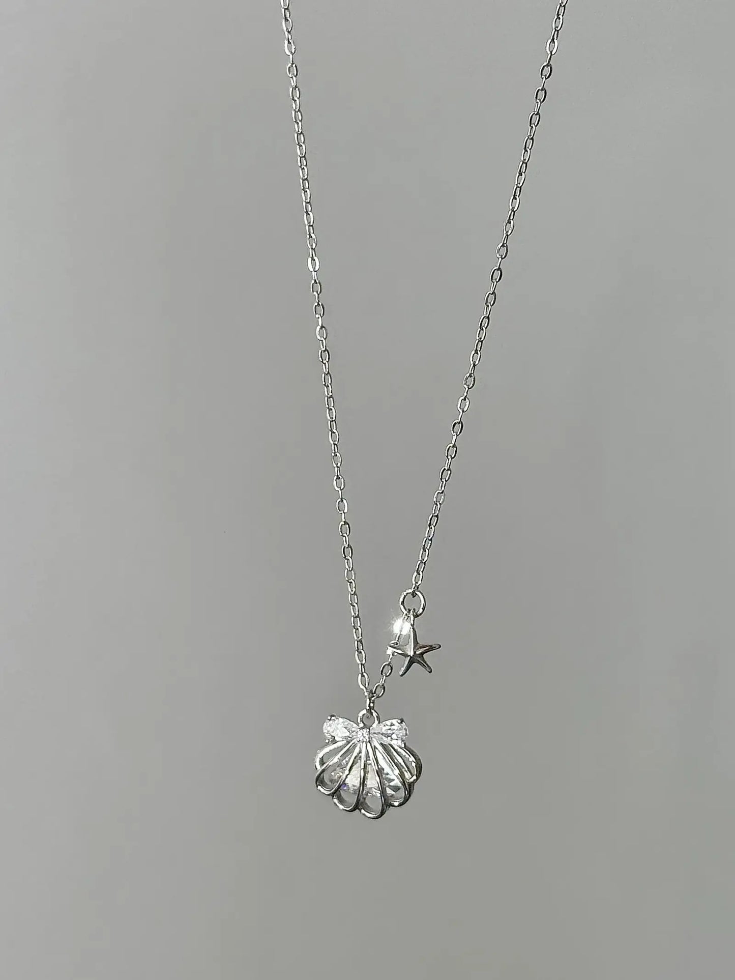 "Silken Star Kiss" 925 Sterling Silver White Gold-Plated Shell Necklace - Delicate, Elegant, and Sparkling.