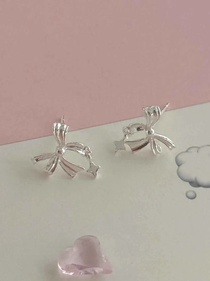 "Ballet Skirt" 999 Pure Silver Hollow Bowknot and Star Stud Earrings - Graceful, Delicate, and Unique.