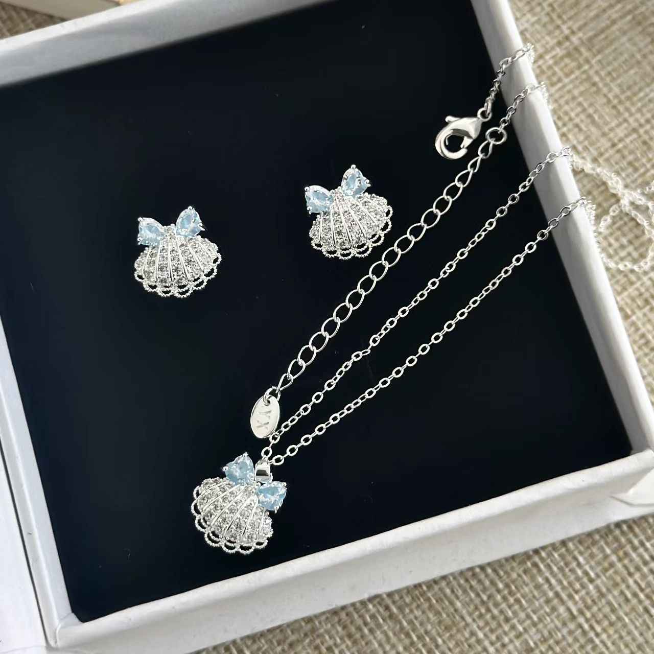 “Azure Shell Bow” Gold Plated Brass Blue Zircon Lace Shell Jewelry Set (Necklace & Earrings)