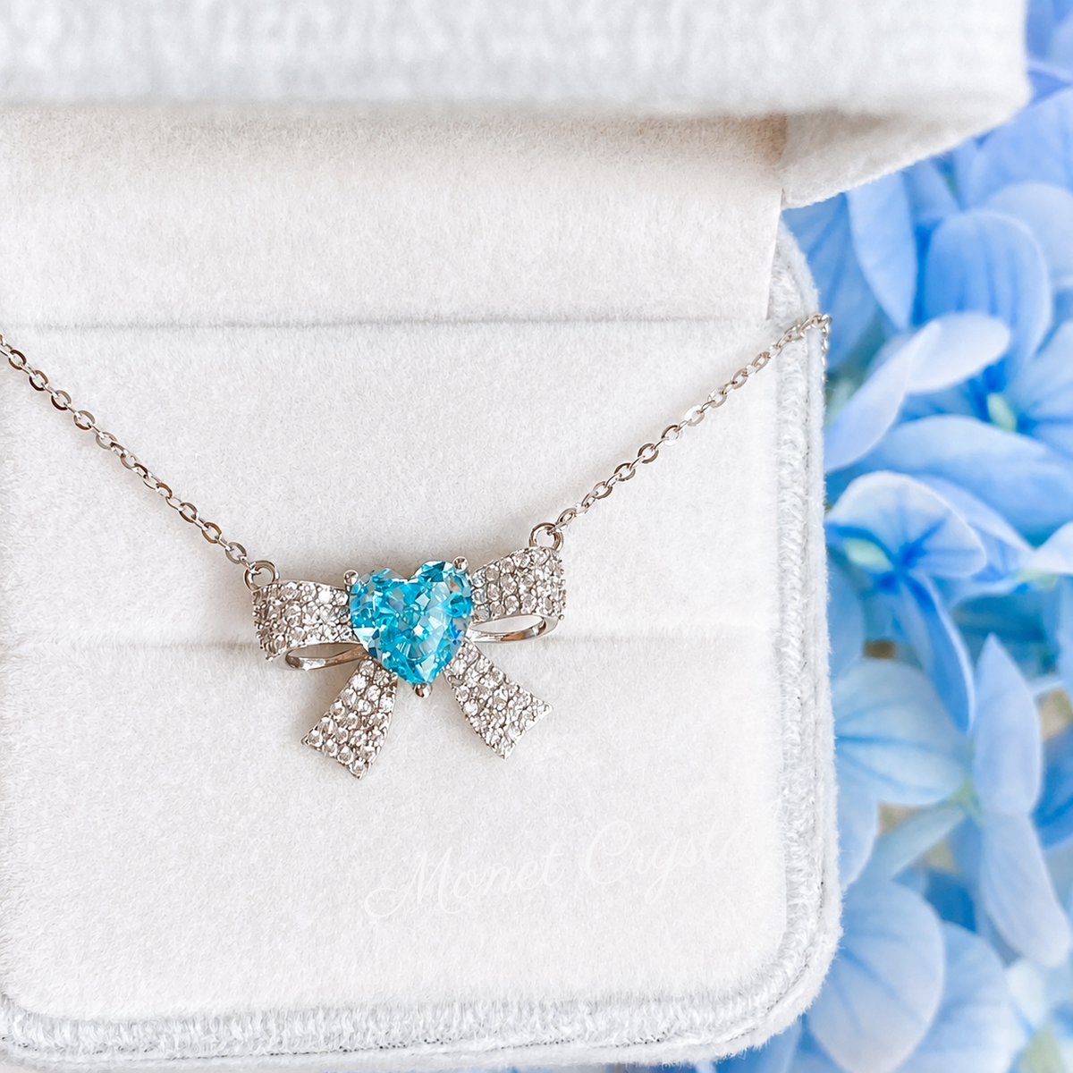 “Blue Bow Éclat” S925 Sterling Silver Ice-Cut Blue Heart Bow Necklace