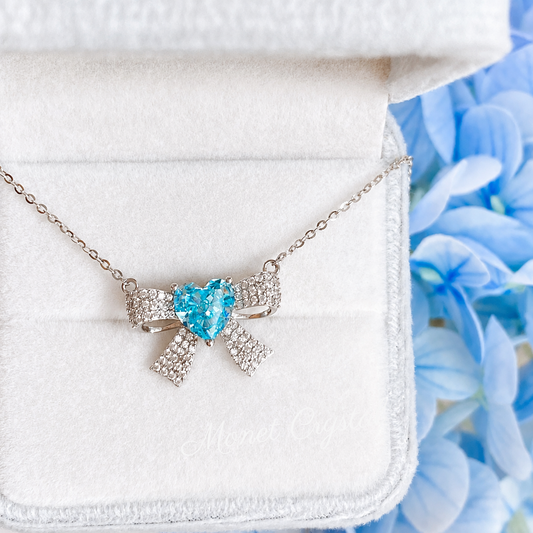 “Blue Bow Éclat” S925 Sterling Silver Ice-Cut Blue Heart Bow Necklace