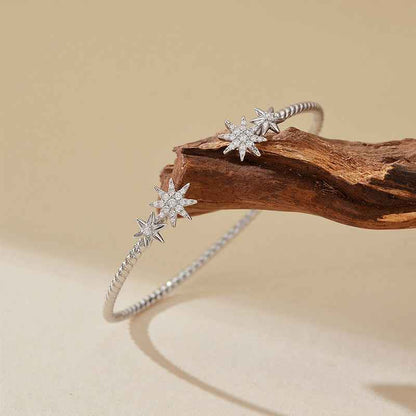 "Celestial Glow" 925 Sterling Silver Starburst Twist Bangle