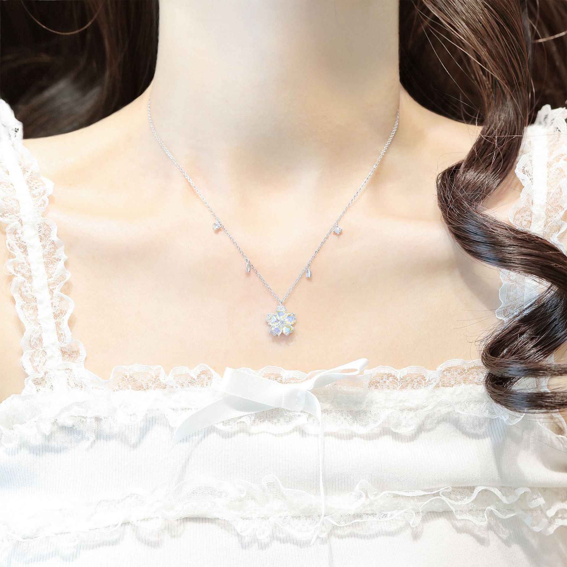 Petal Reverie” 925 Sterling Silver Rotating Sakura Necklace